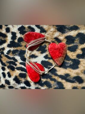 Wire-wrapped bangle bracelet featuring heart-shaped stones